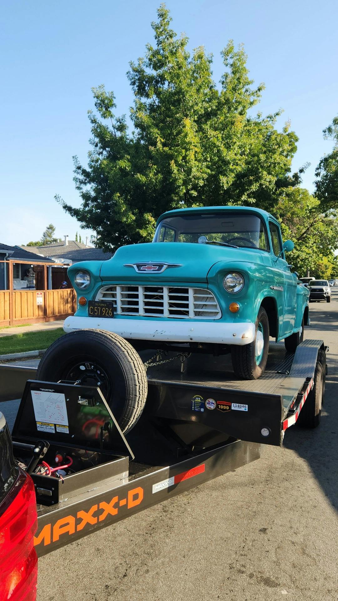 Antique green car being towed by Mike's Tow and Transport LLC