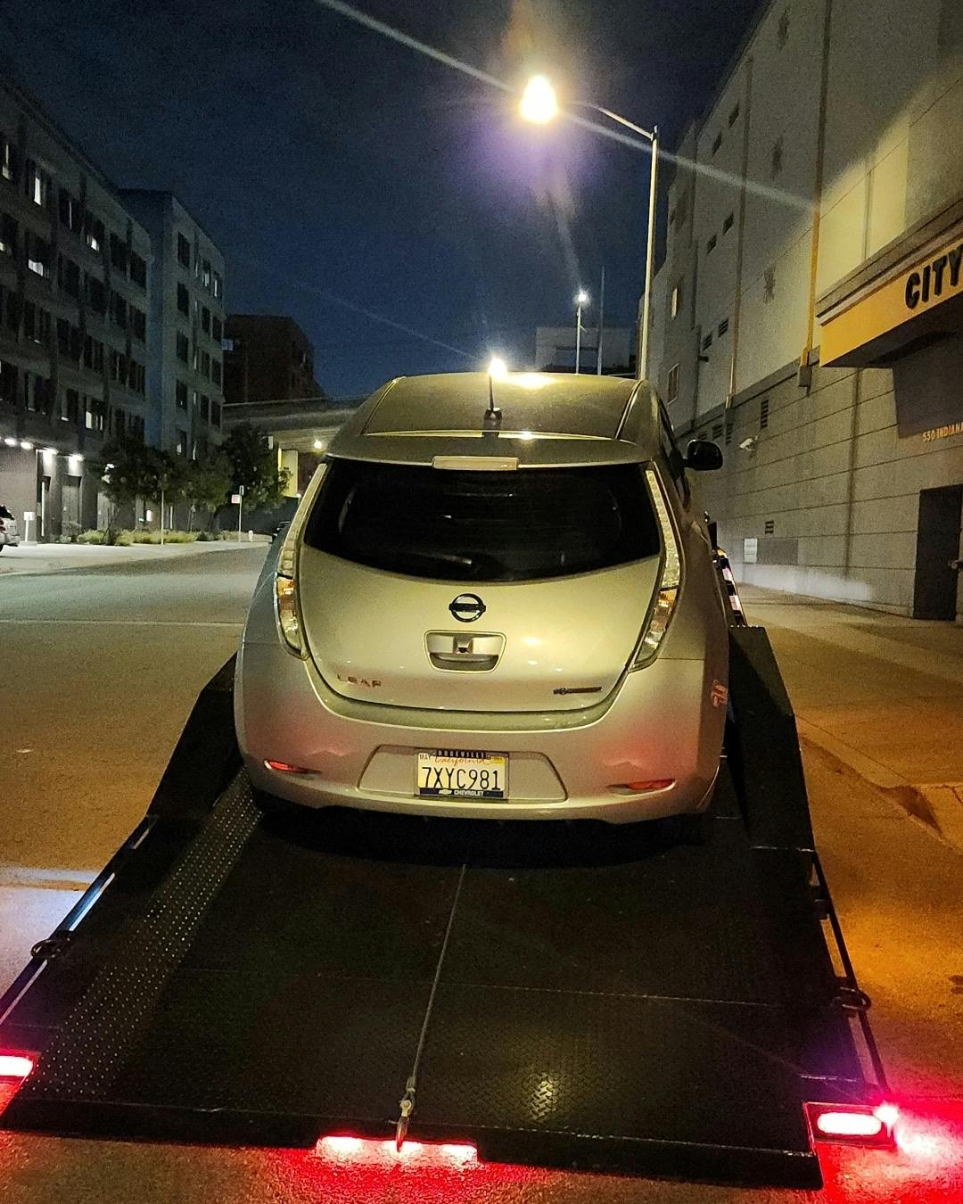 Nissan crossover being towed by Mike's Tow and Transport LLC