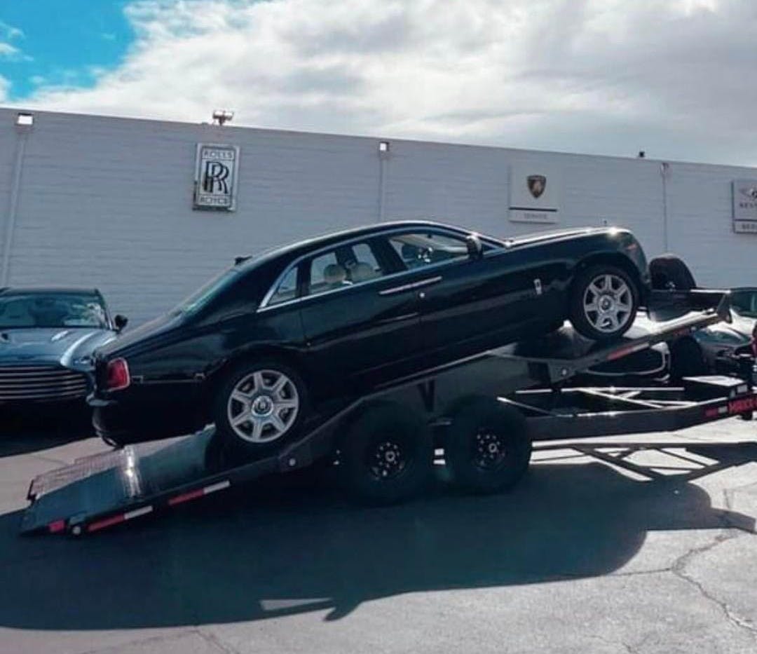 Rolls Royce being towed by Mike's Tow & Transport LLC