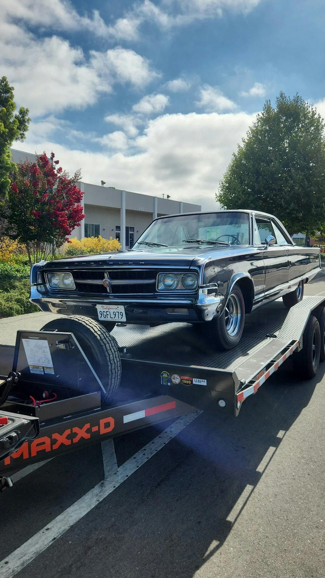 Antique car being towed by Mike's Tow & Transport LLC